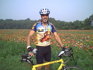 Chris in front of the marigolds