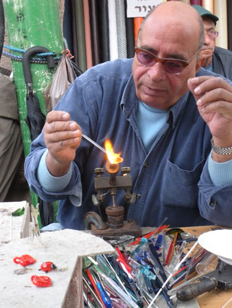 Glass Artisan Working at Craft Market